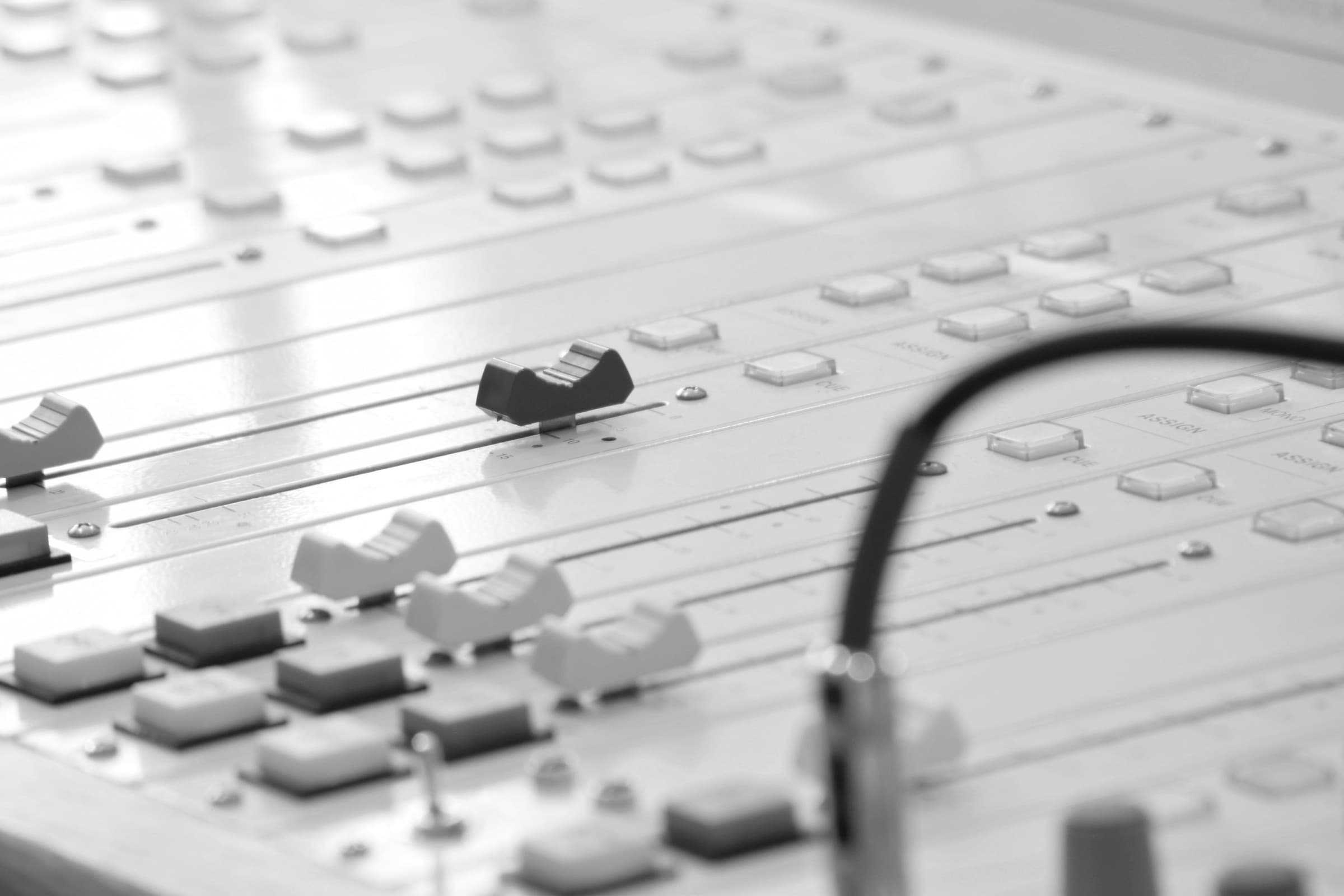 Faders on a mixing console in close-up